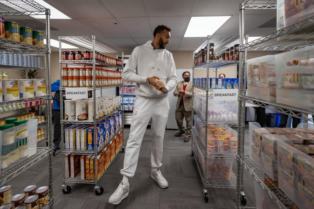 man standing in a food mart